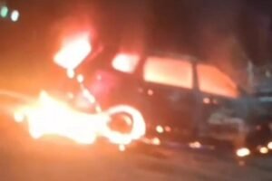 A car caught fire under suspicious circumstances, causing panic. The fire was brought under control after considerable effort.