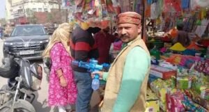 Holi celebrations: Electronic water guns are a rage in the markets of Kashi, spraying colours for six hours.