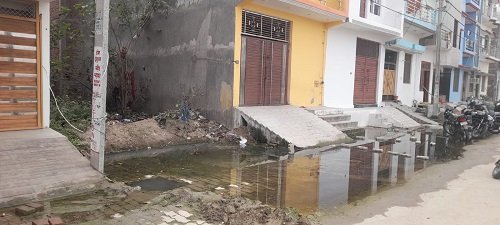 The pain of waterlogging and dilapidated roads in Saket Puri Colony