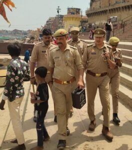 Dashashwamedh police outpost in-charge remains vigilant regarding the safety of devotees amidst the crowds; conducts foot patrol on the ghats.