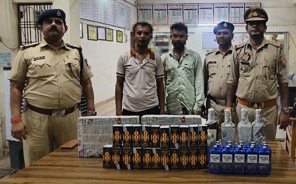 Joint operation by Police and RPF at railway yard; two smugglers arrested with 19.35 liters of illicit Indian-Made Foreign Liquor (IMFL).