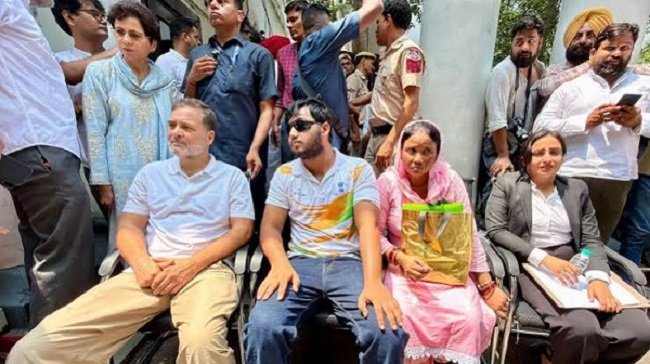 Political uproar in Delhi over allegations of pellet gun use against students; Rahul Gandhi stages a sit-in protest.