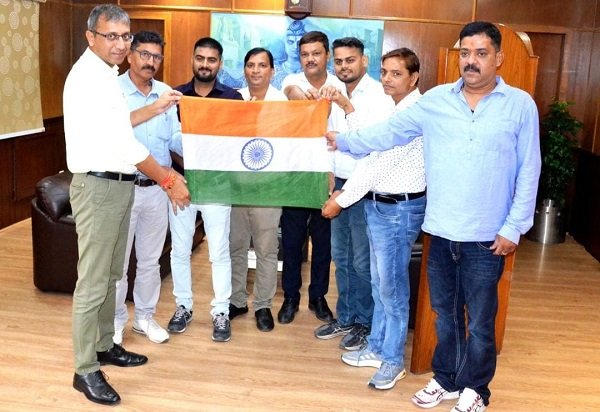 'Har Ghar Tiranga, Har Dil Tiranga': Message of patriotism resonates across Varanasi Division; DRM Ashish Jain distributes the Tricolour to railway staff.