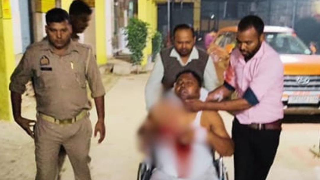 In Varanasi, a man was attacked on the neck with a sharp-edged weapon after assailants entered his home in the middle of the night; he required 20 stitches. A case has been registered against two suspects.